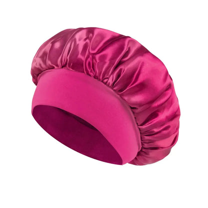 Satin hair bonnet for sleeping, magenta wide-brim style with elastic band.