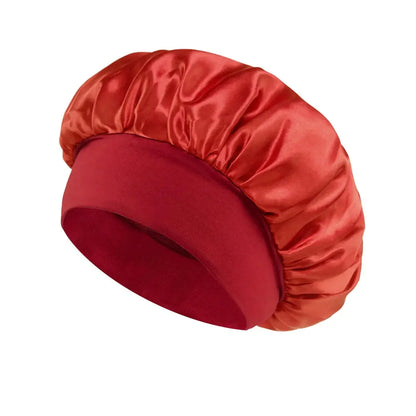 Red satin sleeping bonnet with wide brim and ruched crown.