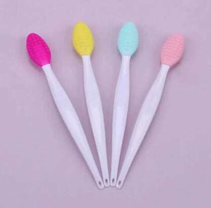 Silicone exfoliating face brush set of four with pastel textured heads on white handles