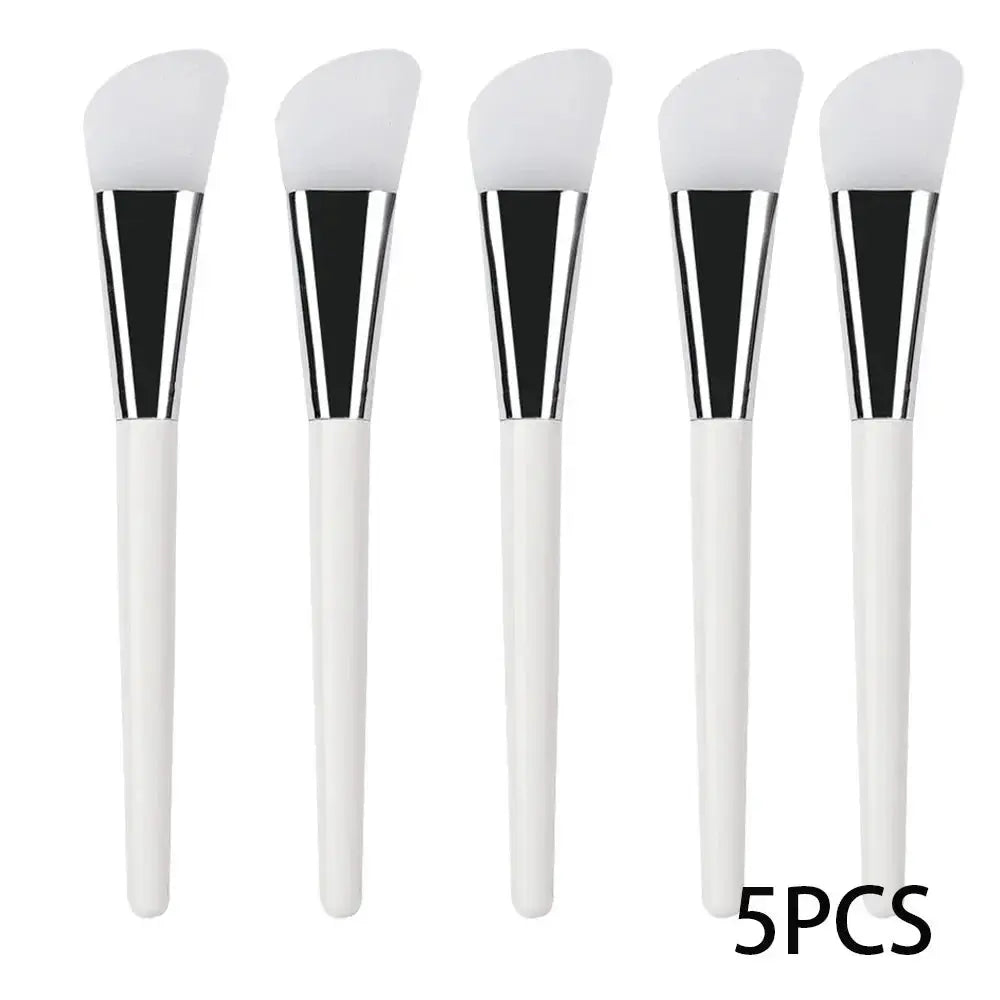 5 silicone face mask applicator brushes with white handles and soft white heads