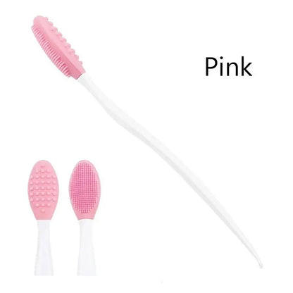 Pink silicone exfoliating brush with curved white handle and textured replacement head