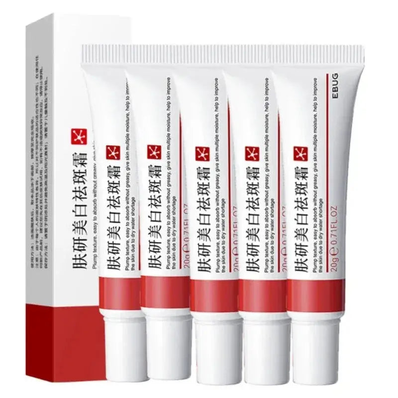 Five freckle whitening cream tubes arranged in front view with matching boxes