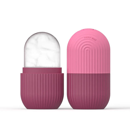 Rose-pink silicone face ice cube mold with frosty ice top, closed