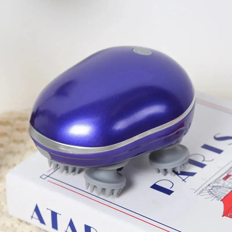 Deep blue head massager with soft silicone scalp massage nodes.