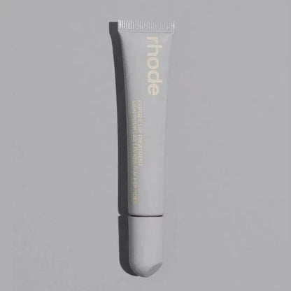 Clear Rhode lip balm tube with ribbed cap and squeeze tip