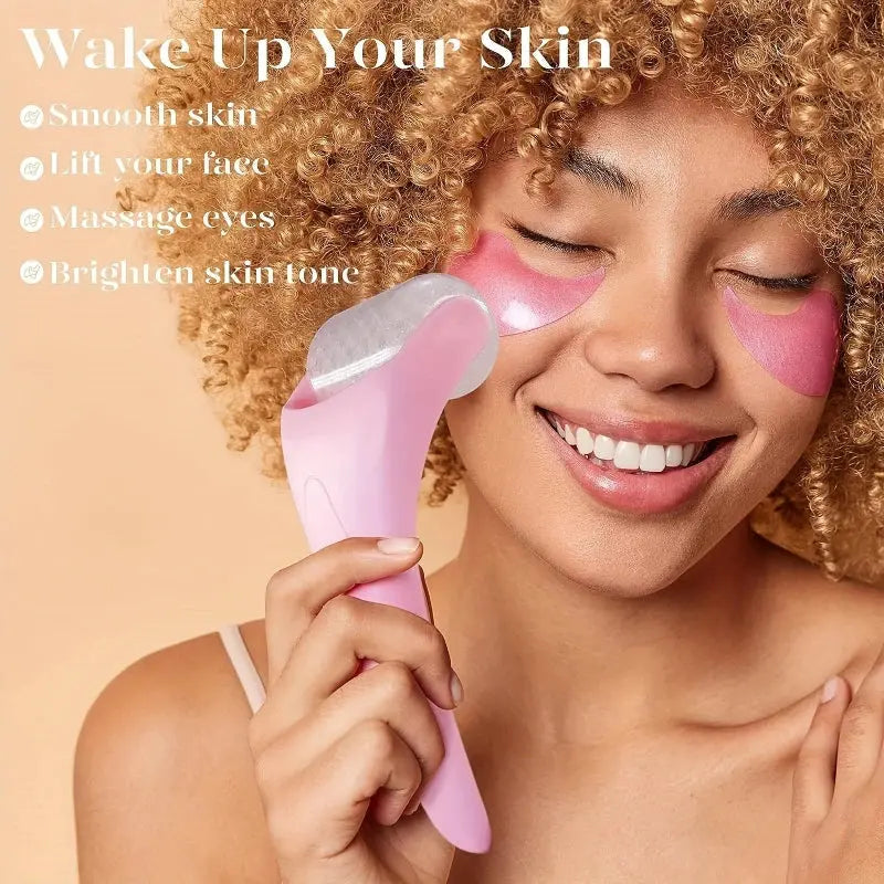 Pink facial ice roller massager held near cheek for cooling and gentle massage