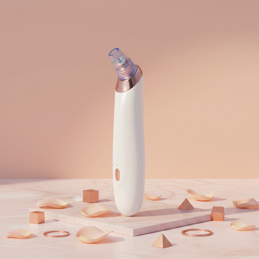 Clarity blackhead extractor upright view, white handle with rose-gold ring and nozzle