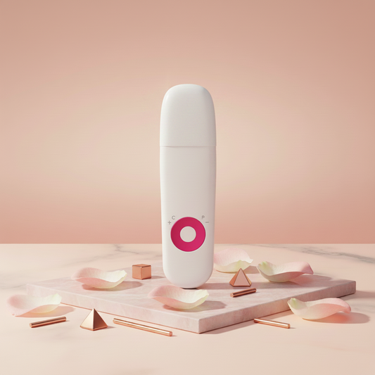 White skin scrubber device with pink O ring and rounded top